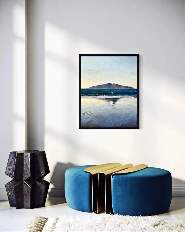 Quiet Horizon Seascape Wall Art in a bright room with modern poufs and natural light. A Calm Ocean Horizon That Brings Stillness to a Space Wall Art.