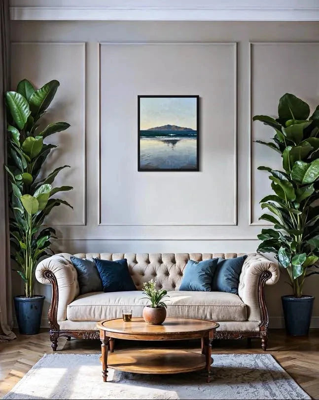 Quiet Horizon Seascape Wall Art centered above a tufted sofa between tall plants in a classic living room. A Calm Ocean Horizon That Brings Stillness to a Space Wall Art.