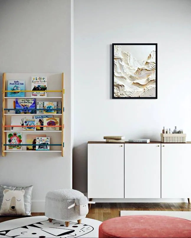 Children's room with bookshelf, white cabinets, and colorful decor