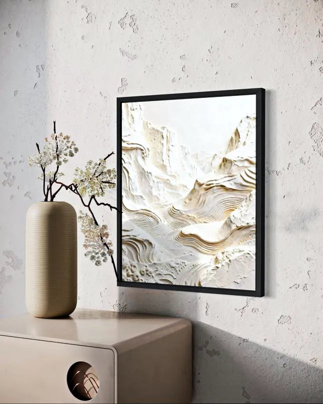 Abstract art piece on a wall with a vase and branches below.